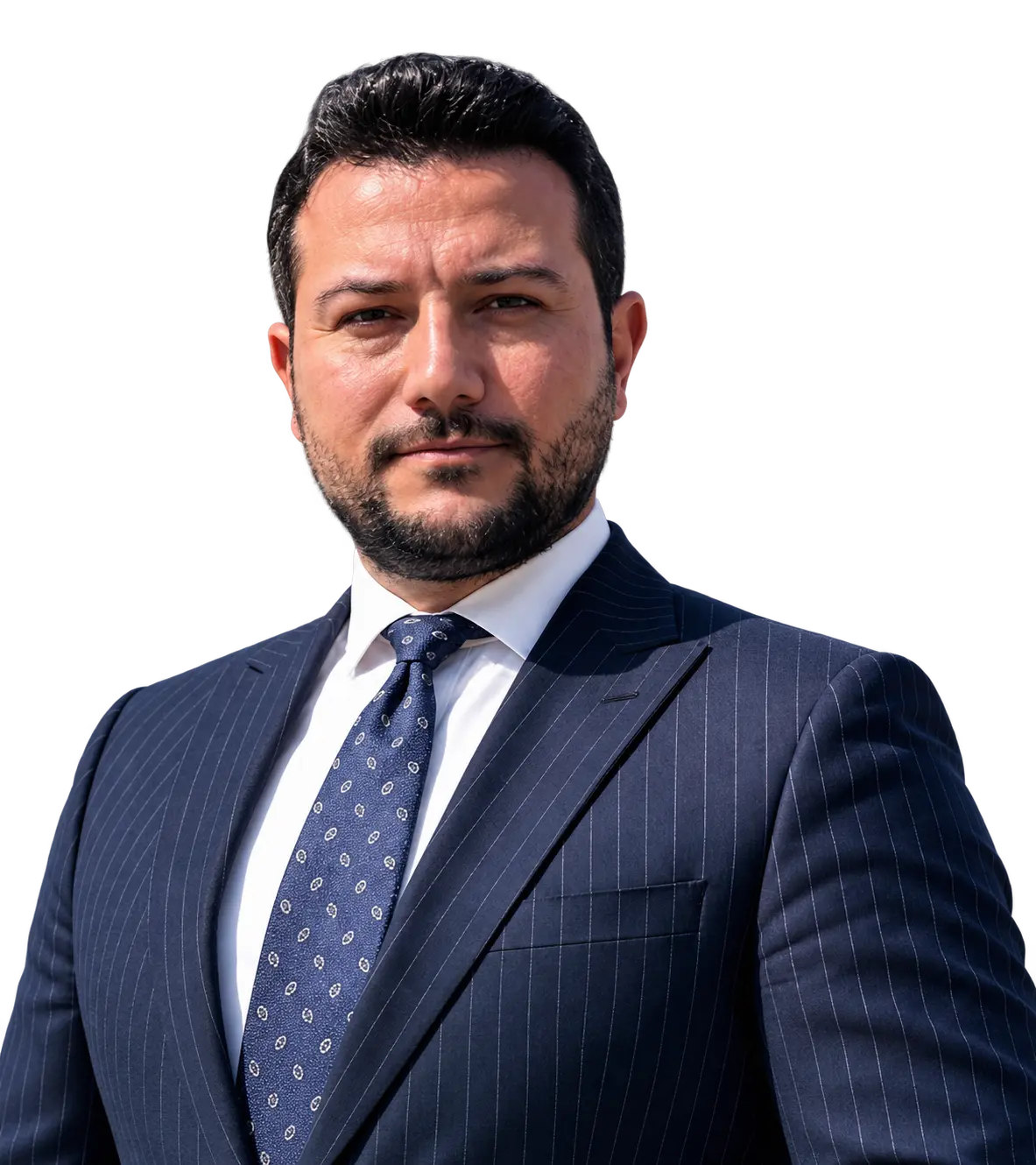 Gokhan Ozcan in a dark pinstripe suit